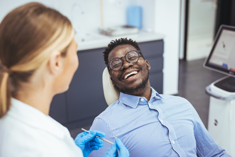 Man smiling with implant dentures in Deer Park, TX