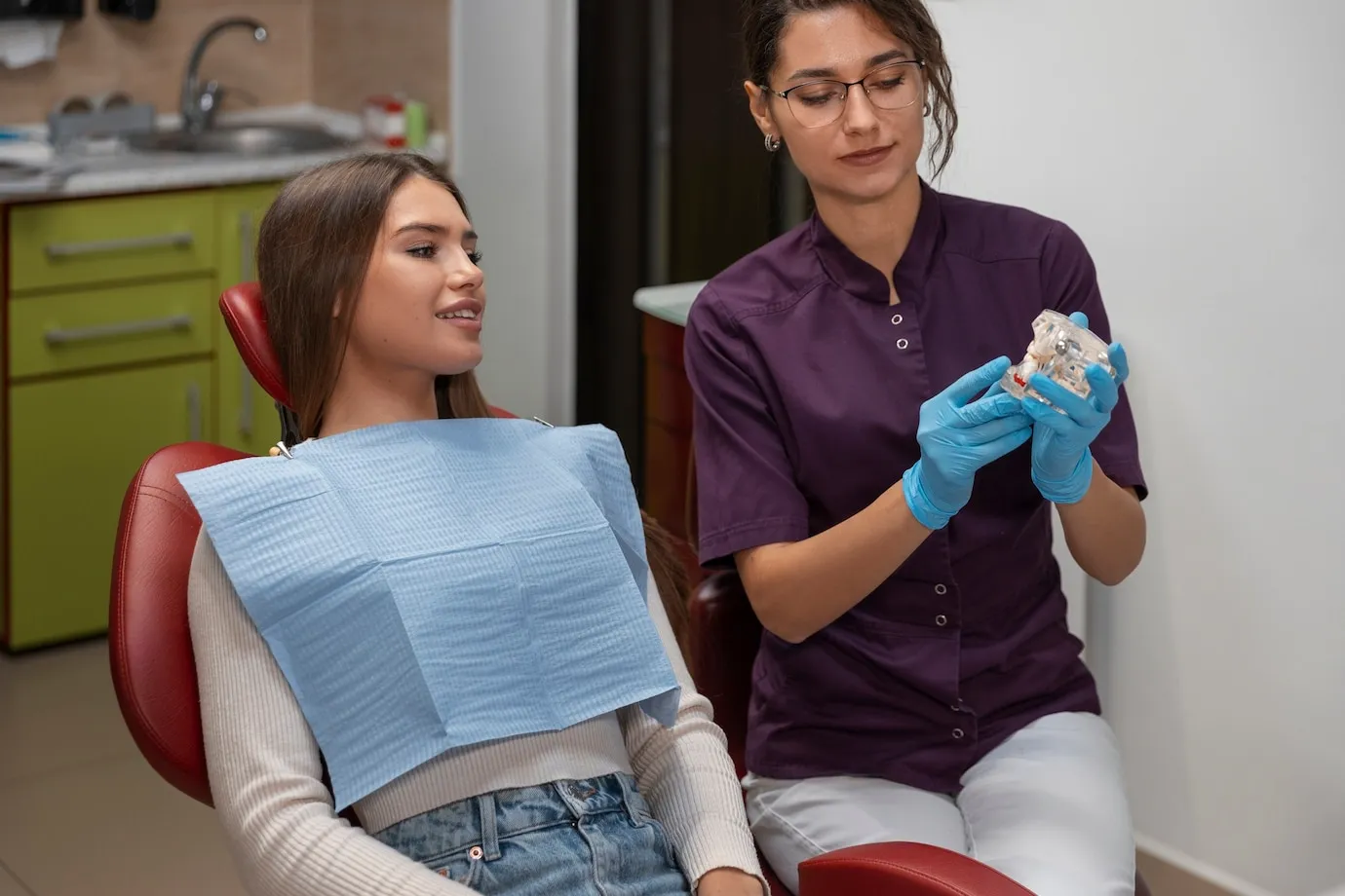 Woman at an all-on-x dental consultation in Deer Park, TX