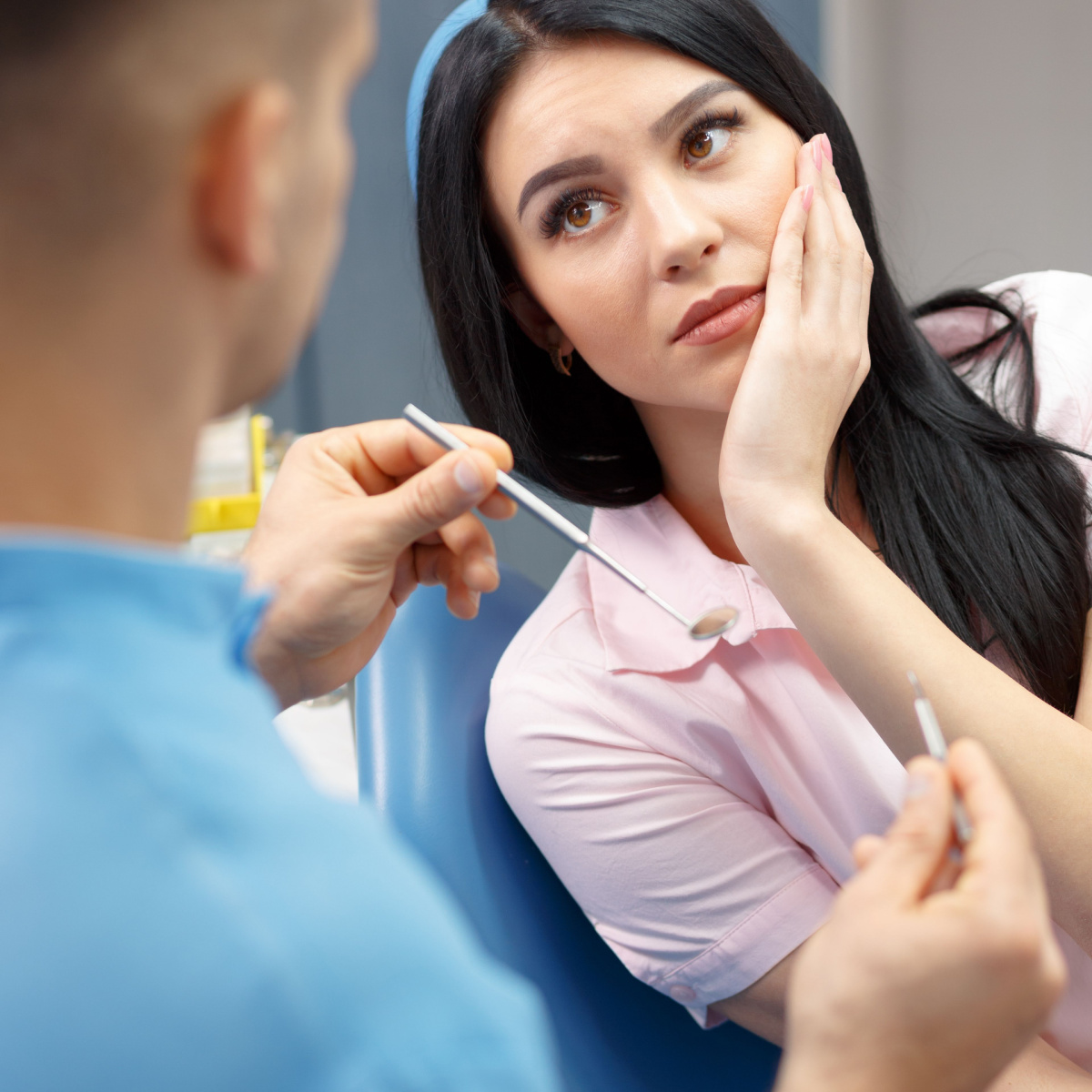 Woman at a dental extraction appointment in Deer Park, TX